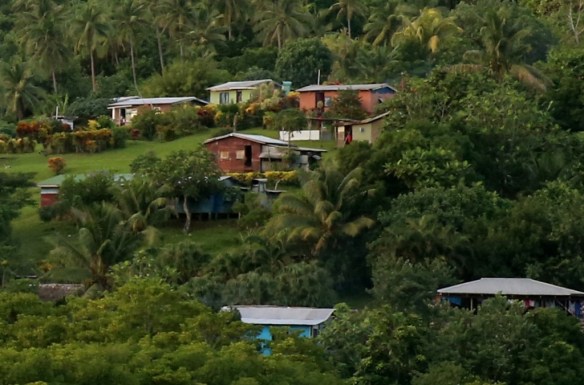 Villagers waving goodbye from their windows and doorways.